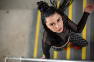 Steven Perdikis Photography fashion photograph of a girl flicking her hair back as she walks up stairs